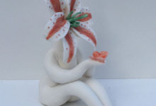 Little Miss Red Lily holding Butterfly Sculpture
