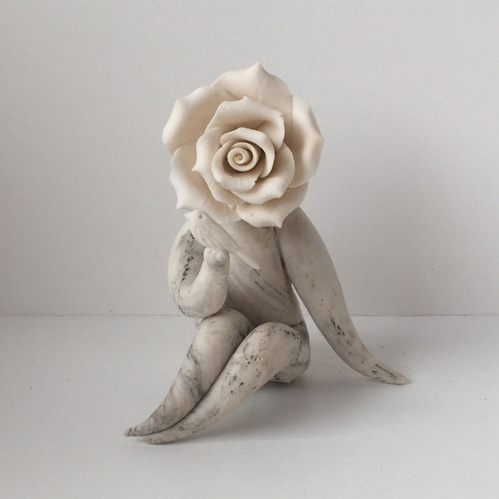 lady rose with bird flower sculpture