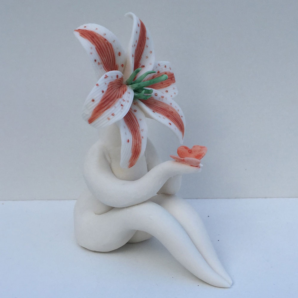 Little Miss Red Lily holding Butterfly Sculpture