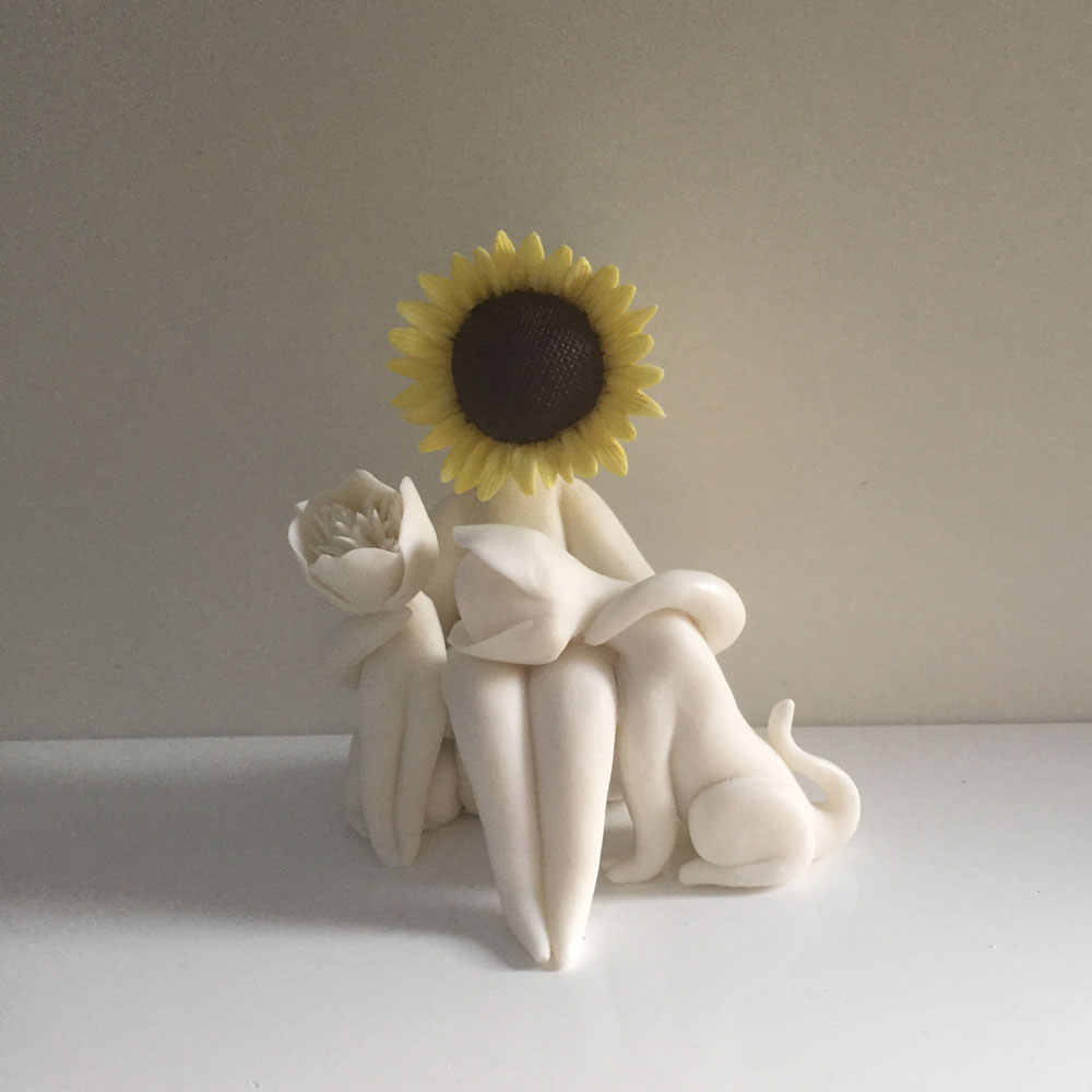 Sunflower lady two dogs flower sculpture