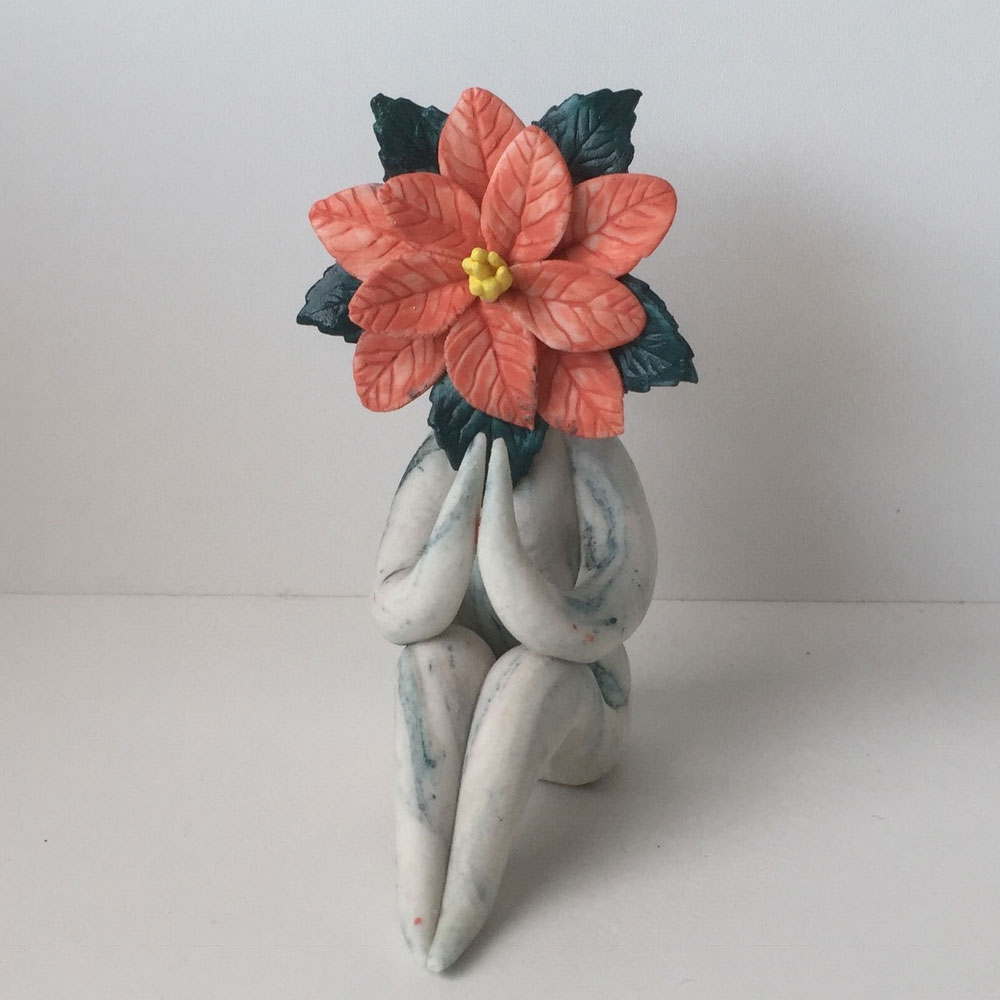 preying poinsettia flower sculpture