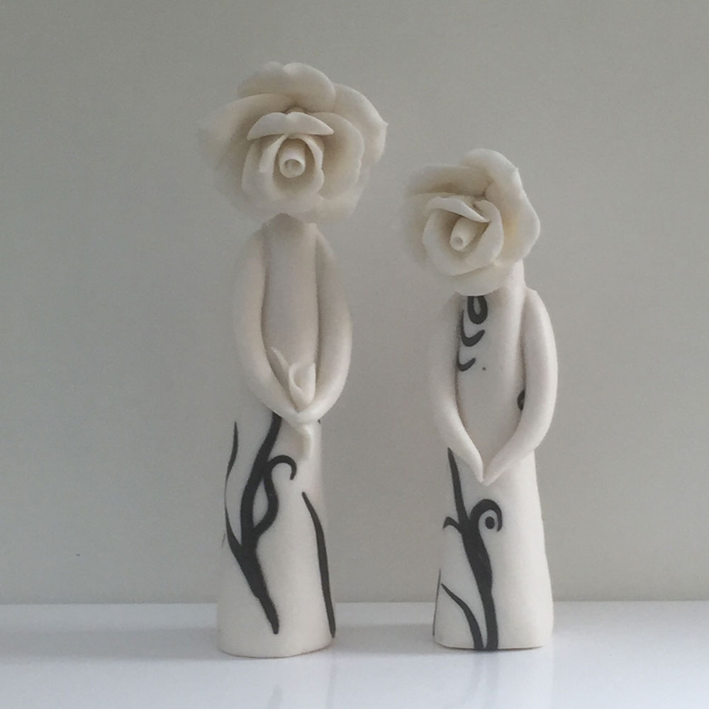 standing-pair-flower lady ceramic sculpture